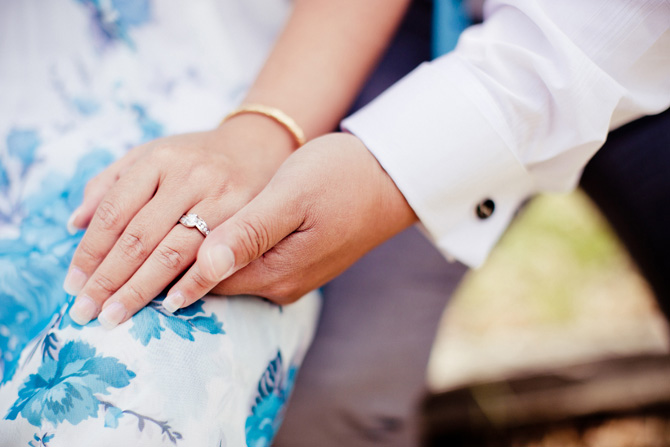Quynh and Loc holding each other's hand showing their engagement ring